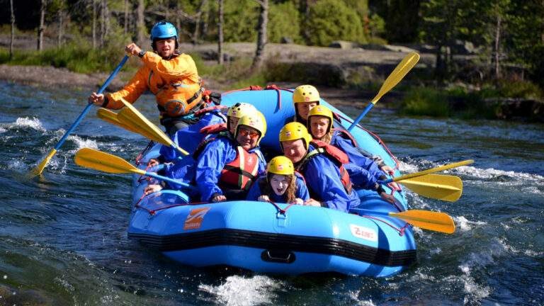 Young people white water rafting