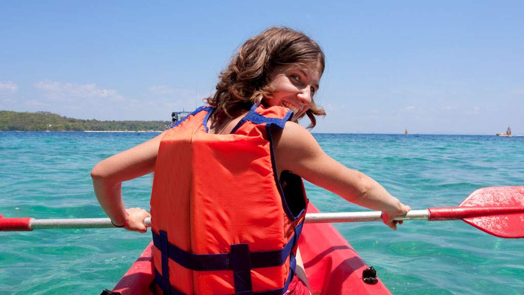 young person kayaking in the sea