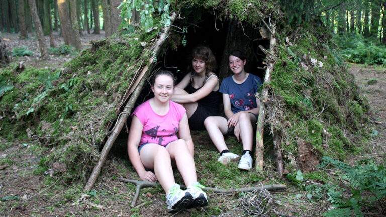 young people den building in the woods