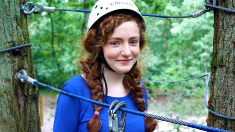 young girl on a high rope course