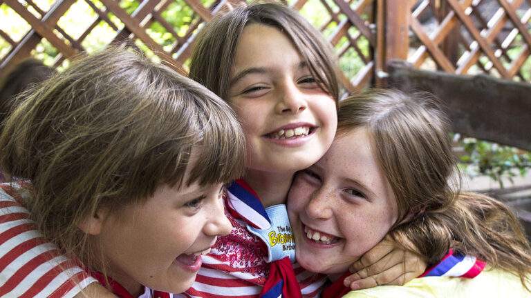 Young girls smiling at a camera