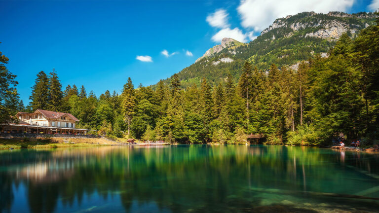 Mountain lake Blausee located in the Kander valley above Kandergrund in the Jungfrau region