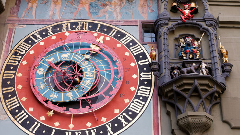 Astronomical clock on the medieval Zytglogge clock tower in Kramgasse street in old city center of Bern, Switzerland.