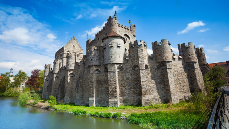 Gravensteen castle in Ghent, Belgium, Europe. Gravensteen castle in Ghent, Flemish region of Belgium during daytime in summer view with river from the bridge