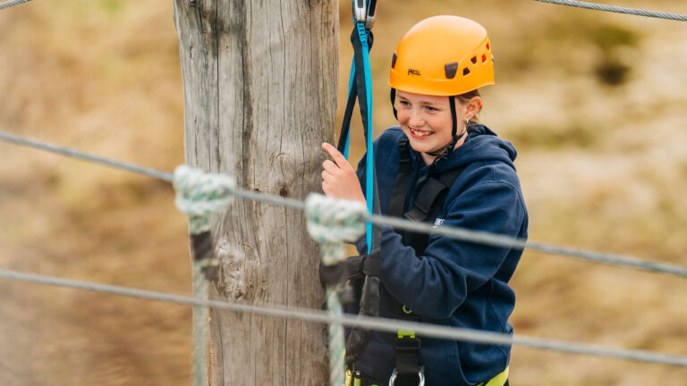 Young person on a high ropes course