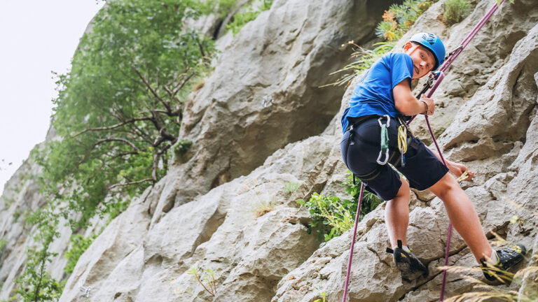 young scout abseiling