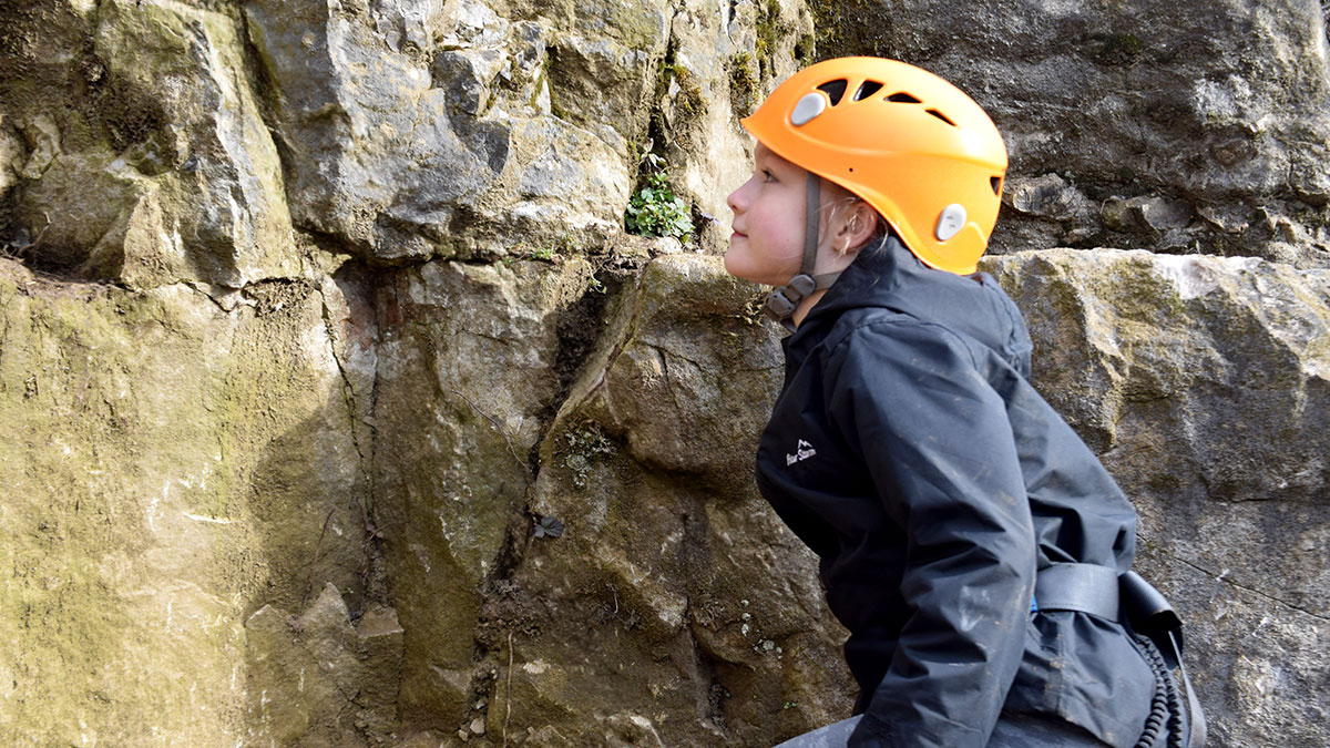 young girl bouldering