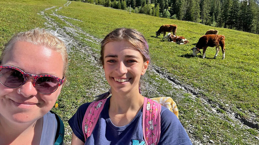 Reps selfie with swiss cows in background