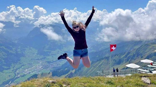 Girl jumping for joy in Switzerland