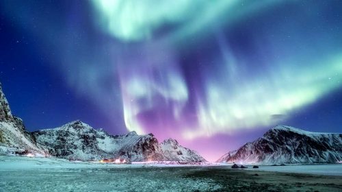 Aurora borealis on the Lofoten islands, Norway. Green northern lights above mountains