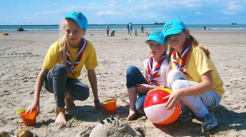 Girl guide group on tour in France on a beach