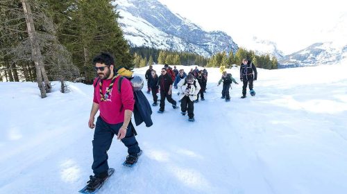 Group of people snowshoeing at KISC in Switzerland